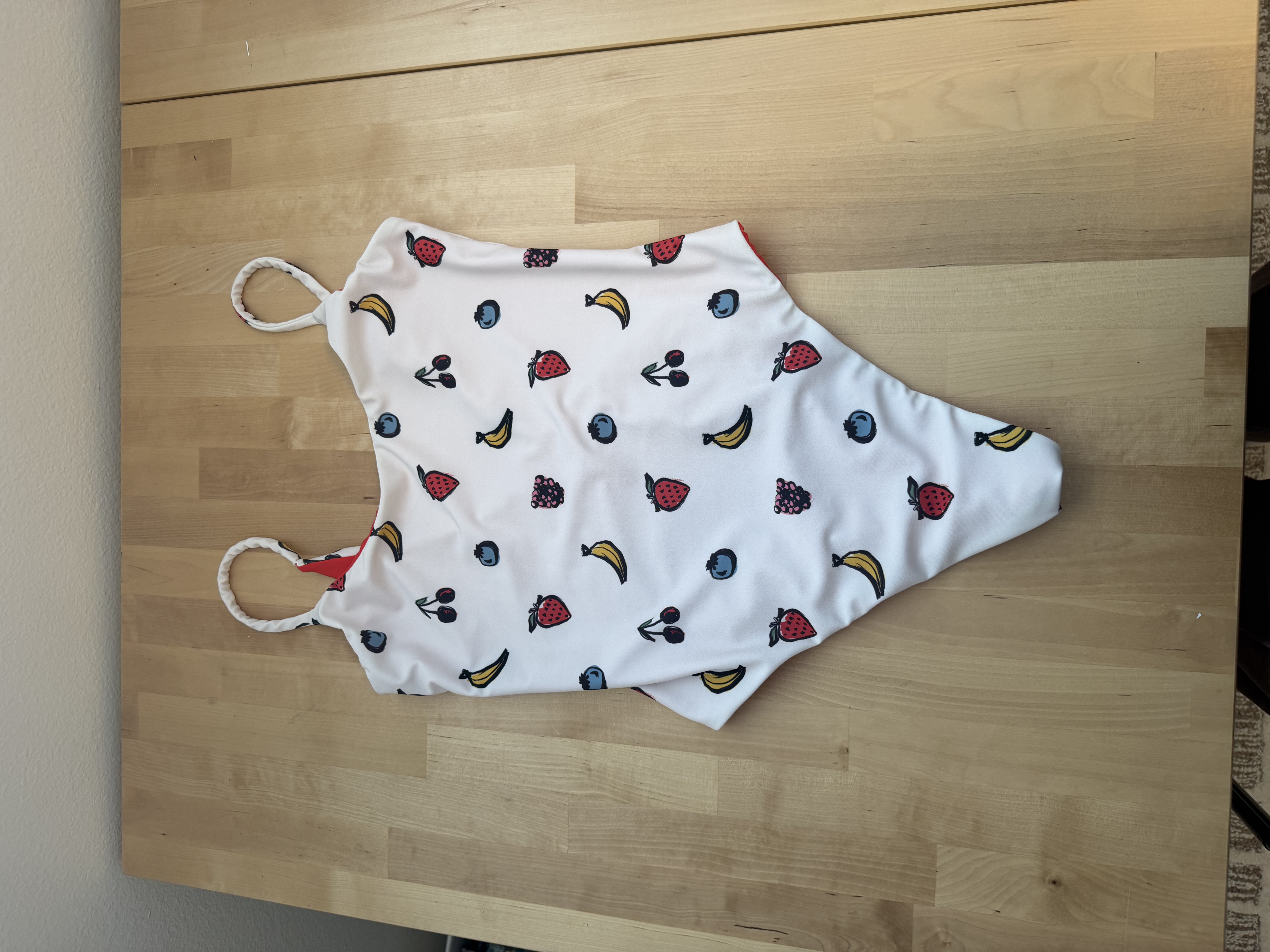 The finished white fruit print Olivia One Piece swimsuit, front view